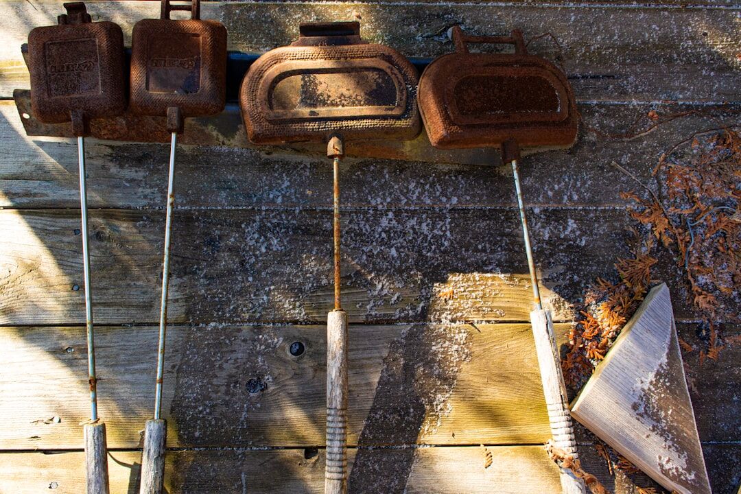 Collection of gardening tools resting on a wooden table